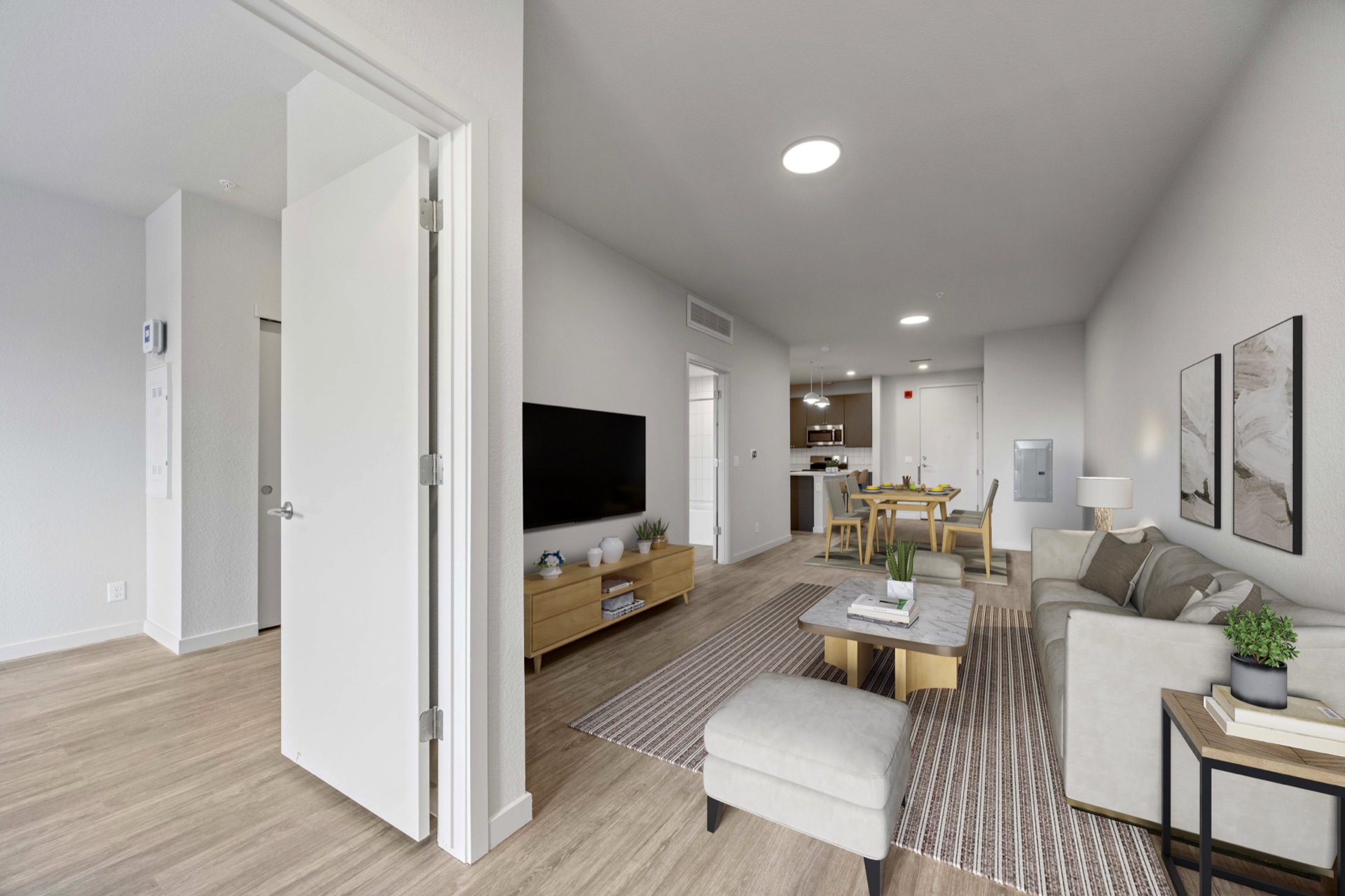 Spacious open-concept living room with premium finishes in a luxury apartment at The Cooper in Lakewood, CO
